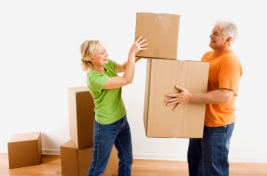 Man and woman moving boxes